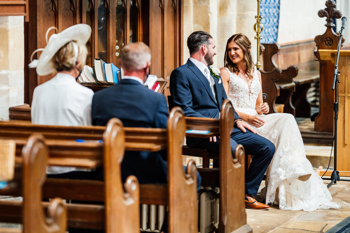bride and groom sitting together during the ceremony