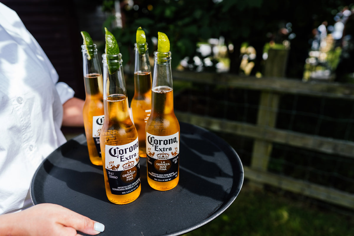 Corona beers on a tray for wedding guests