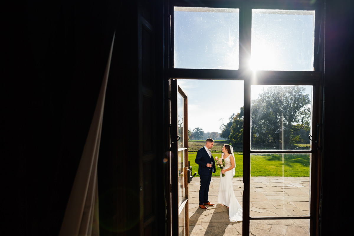 Bride & Groom have a moment to themselves outside in the sunshine