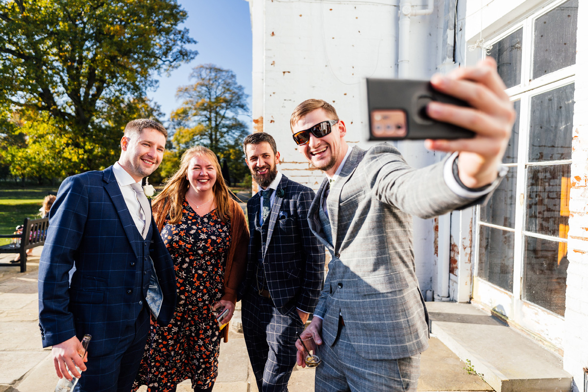 Wedding guests take a selfie