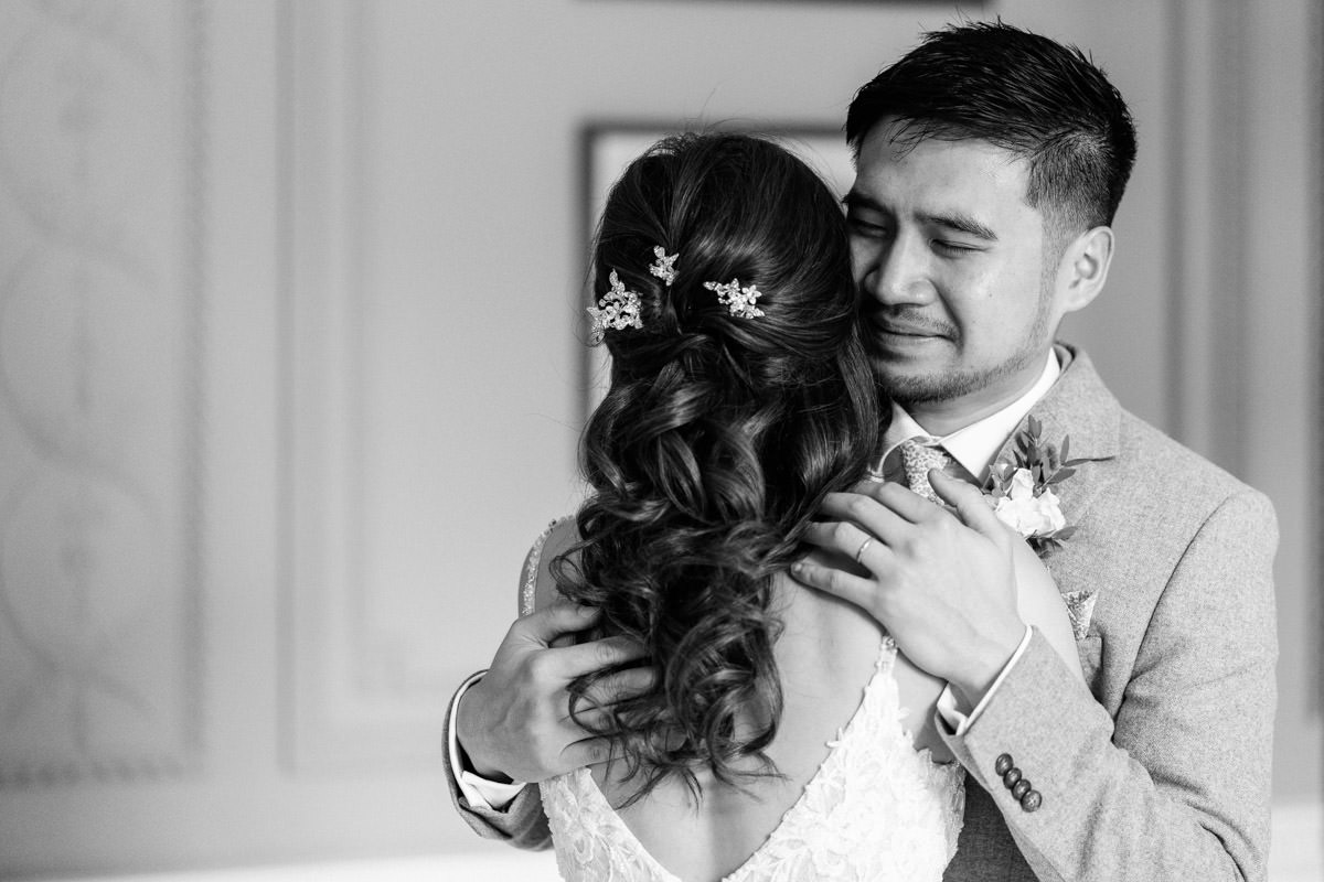 brother of the bride embraces with tears