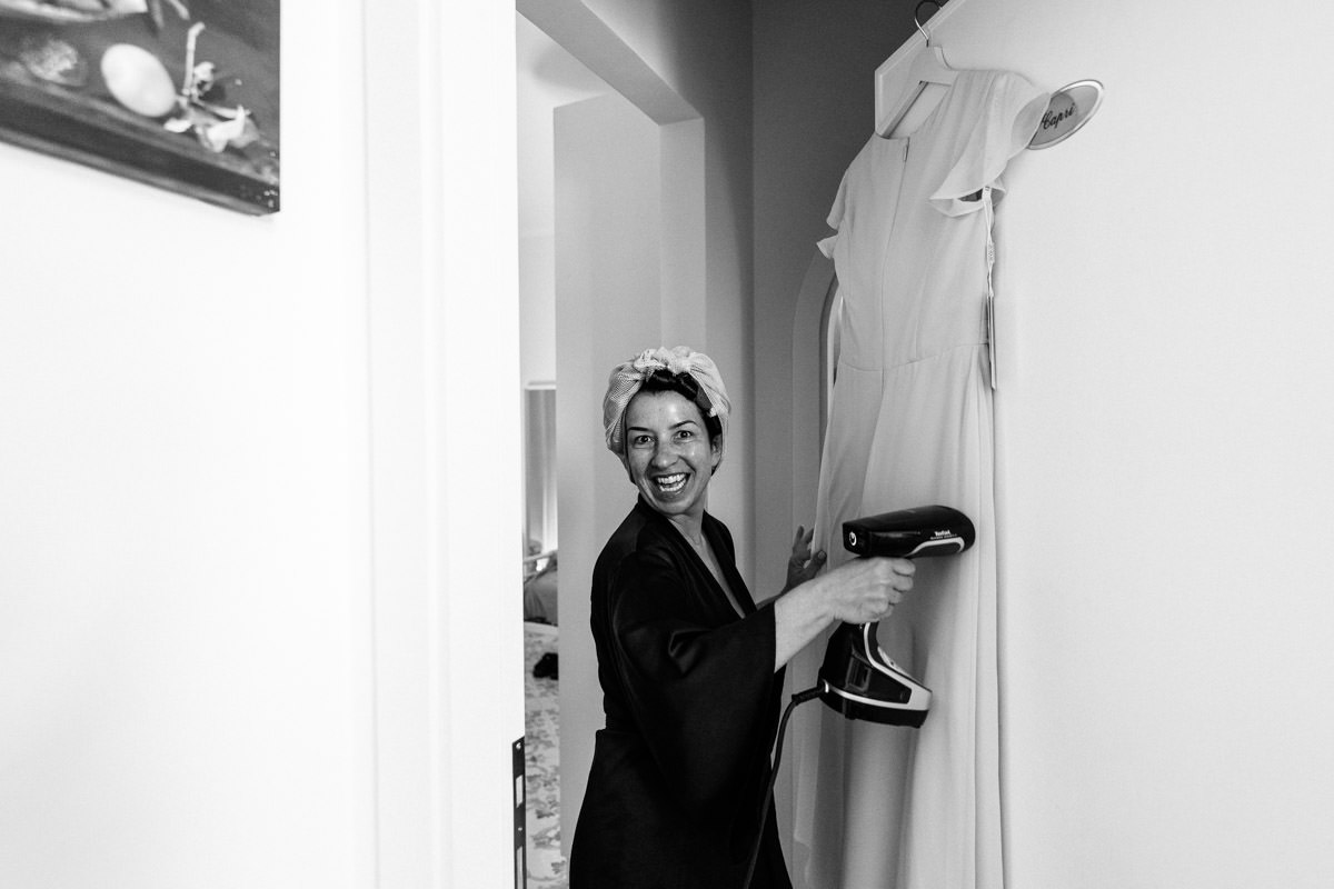 morning prep with mother of the bride steaming the dresses