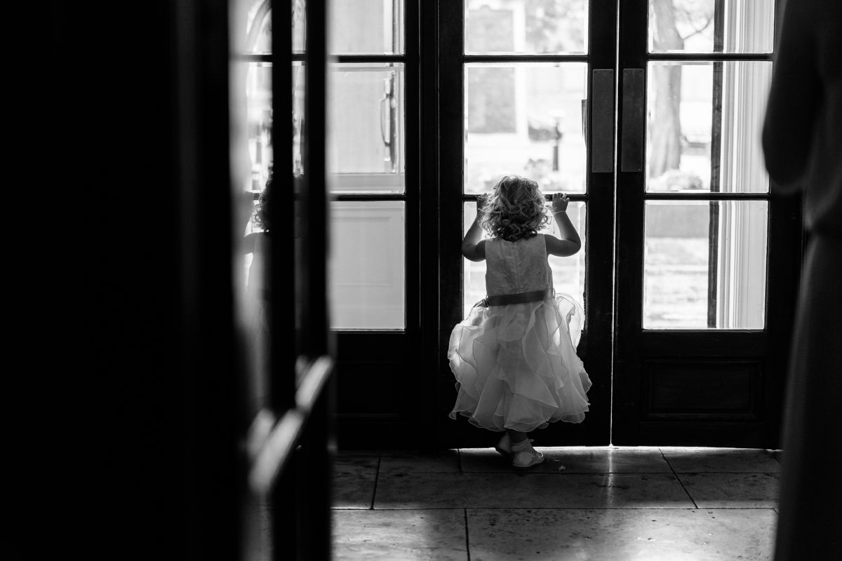 flower girl watching out of the door