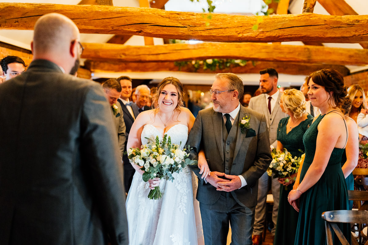 bride walked down the aisle by her father