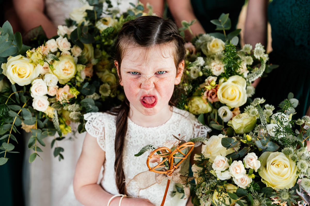 flower girl pulling a funny face