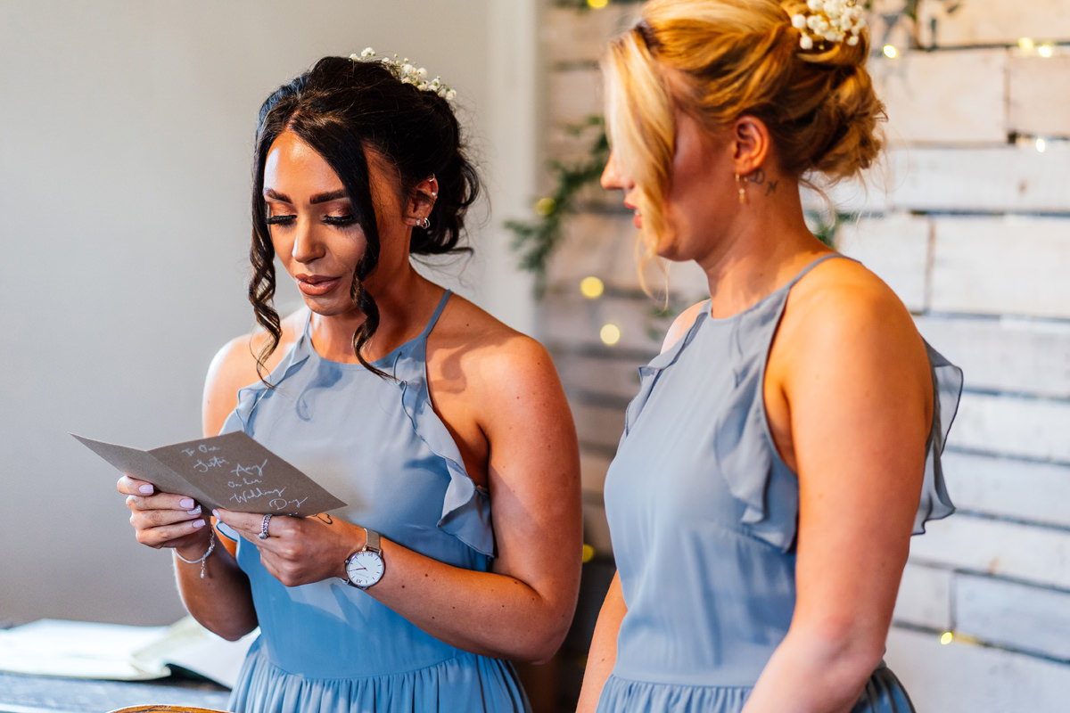 bridesmaid delivering a reading during the ceremony