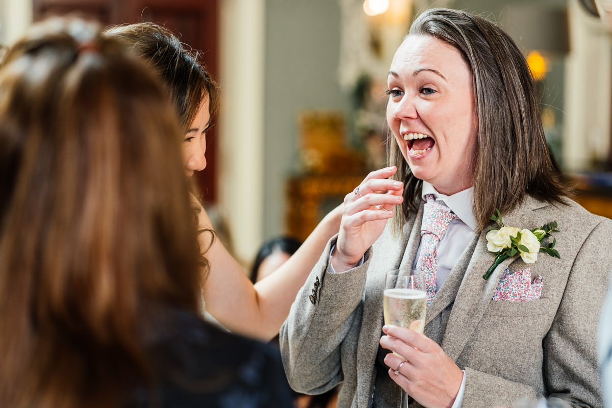 best woman laughing during the drink reception