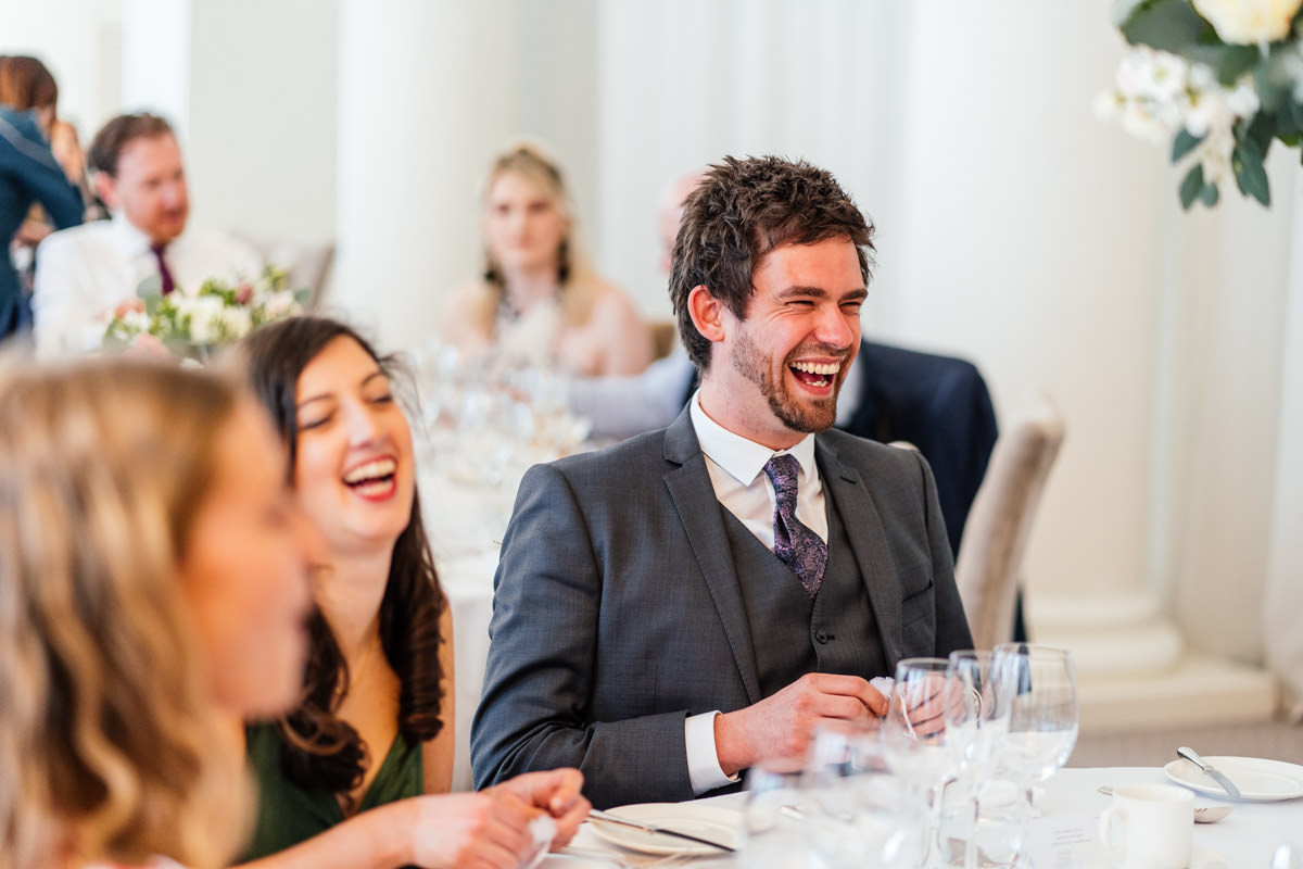 Guests laughing during the wedding breakfast