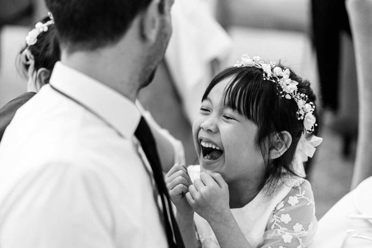 flower girl laughing during the wedding breakfast