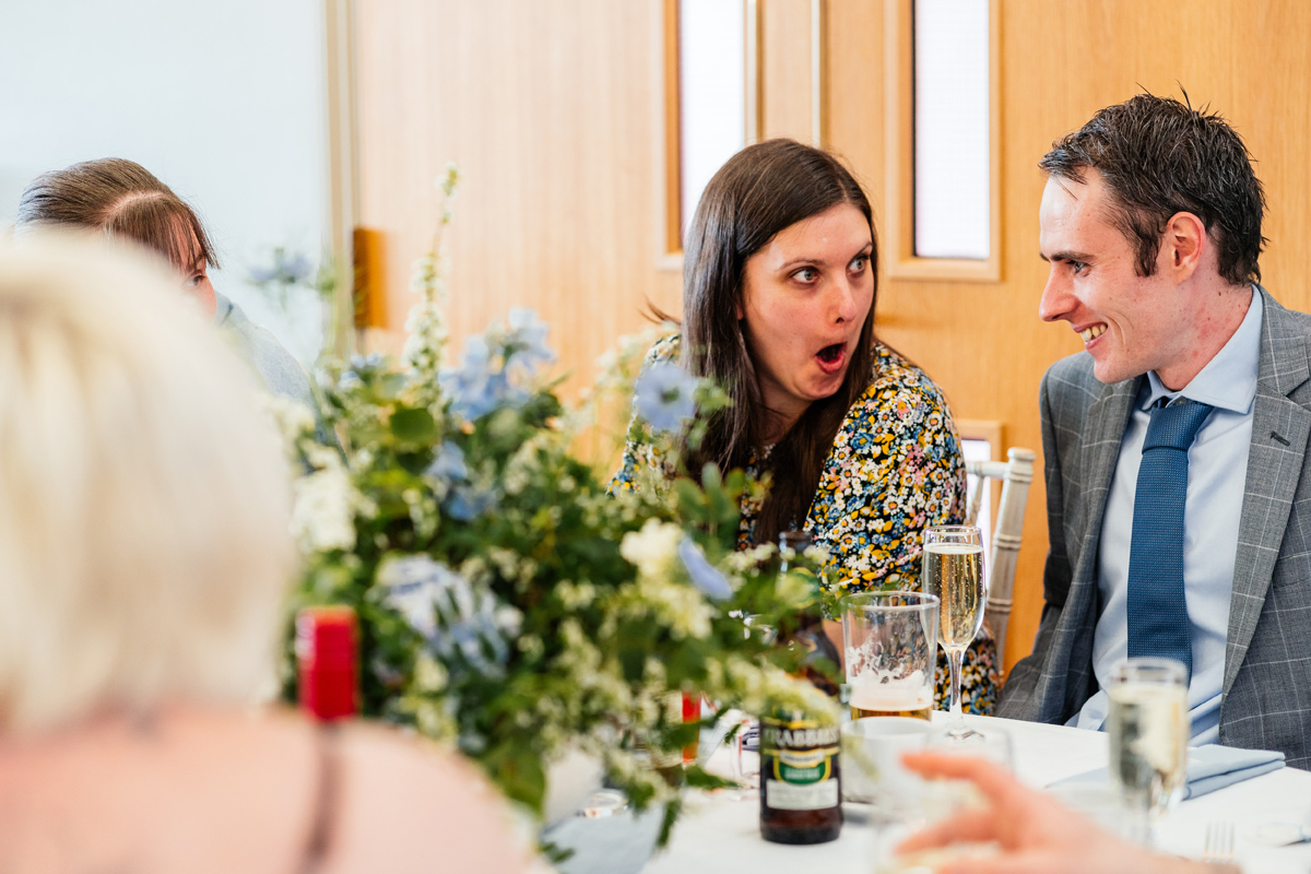 wedding guest pulling a funny face during the wedding breakfast and speeches