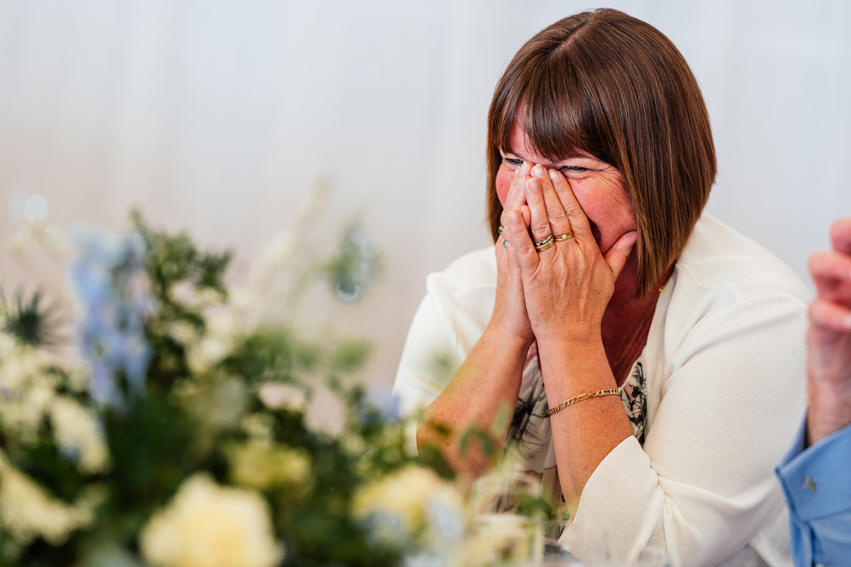 wedding guest laughing during the speeches