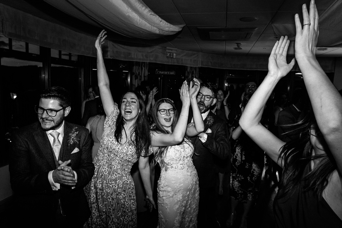 bride and her friends enjoying the dance floor