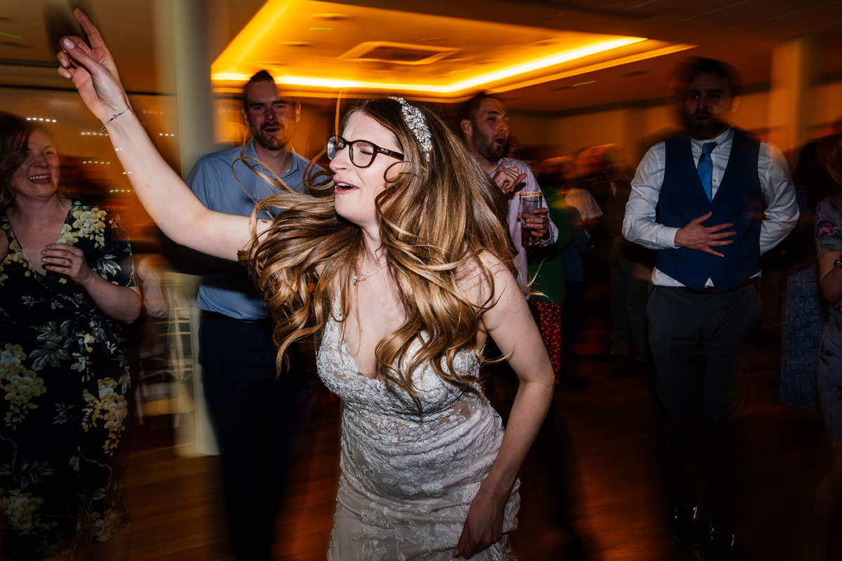 bride dancing and singing during the evening party