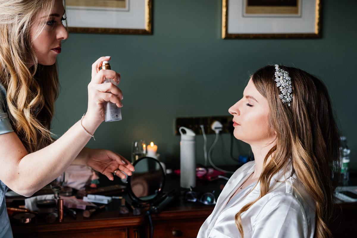 Bride having her make-up done on the morning of her wedding