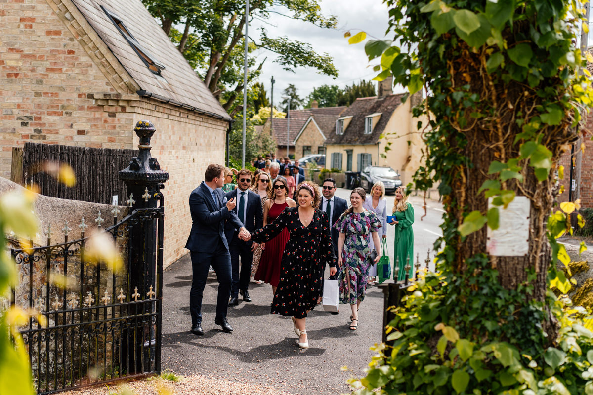 wedding guests arriving at church