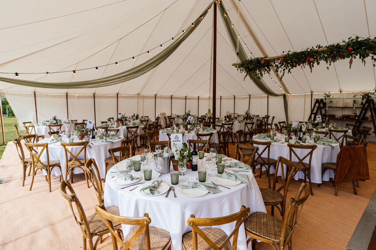 marquee wedding details with table and chairs