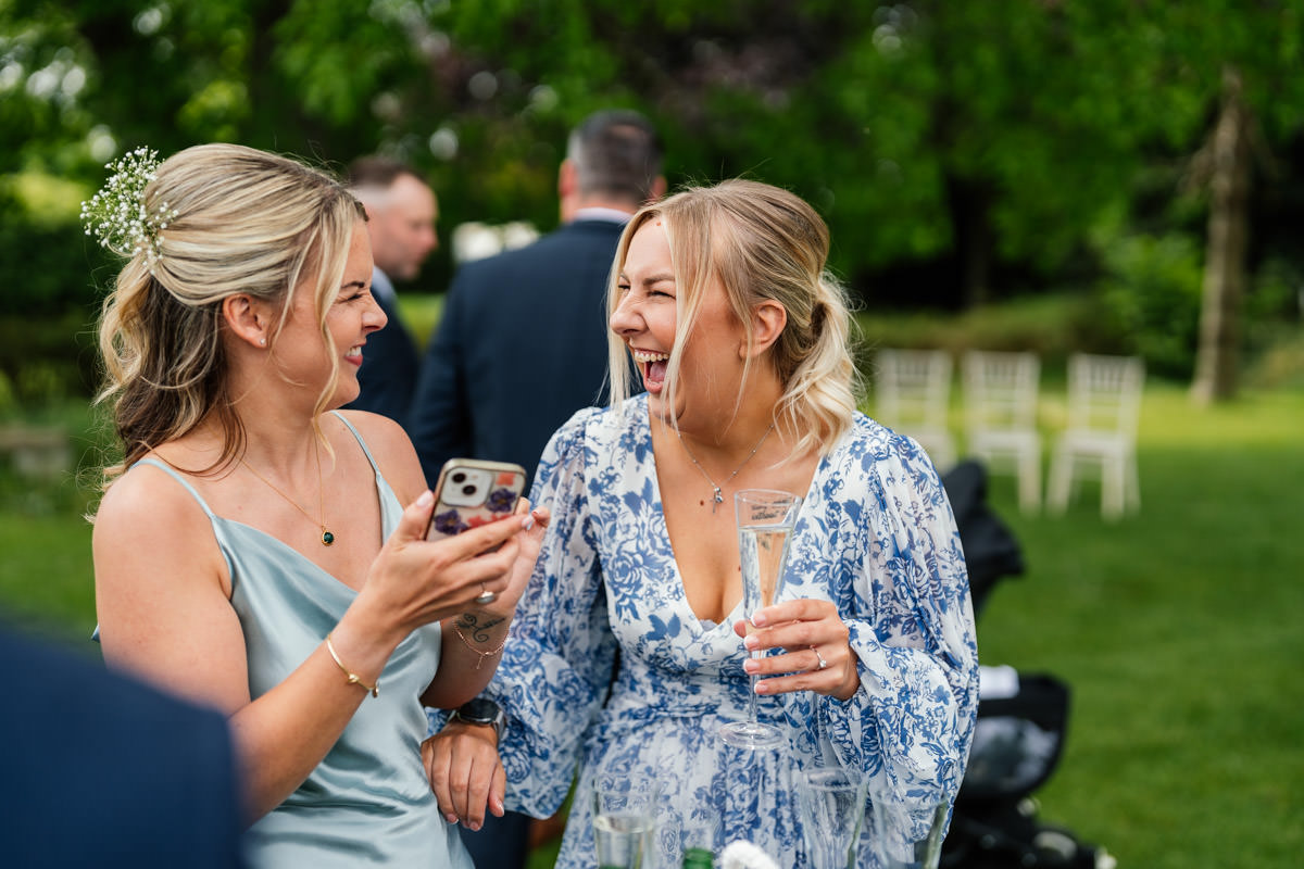 Girls laughing during the drinks reception