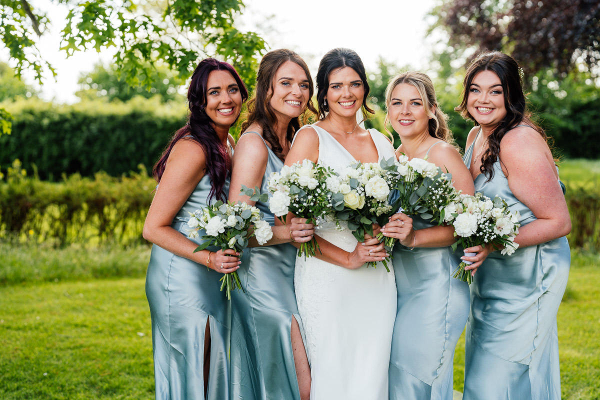 Bride and bridesmaids formal group photo