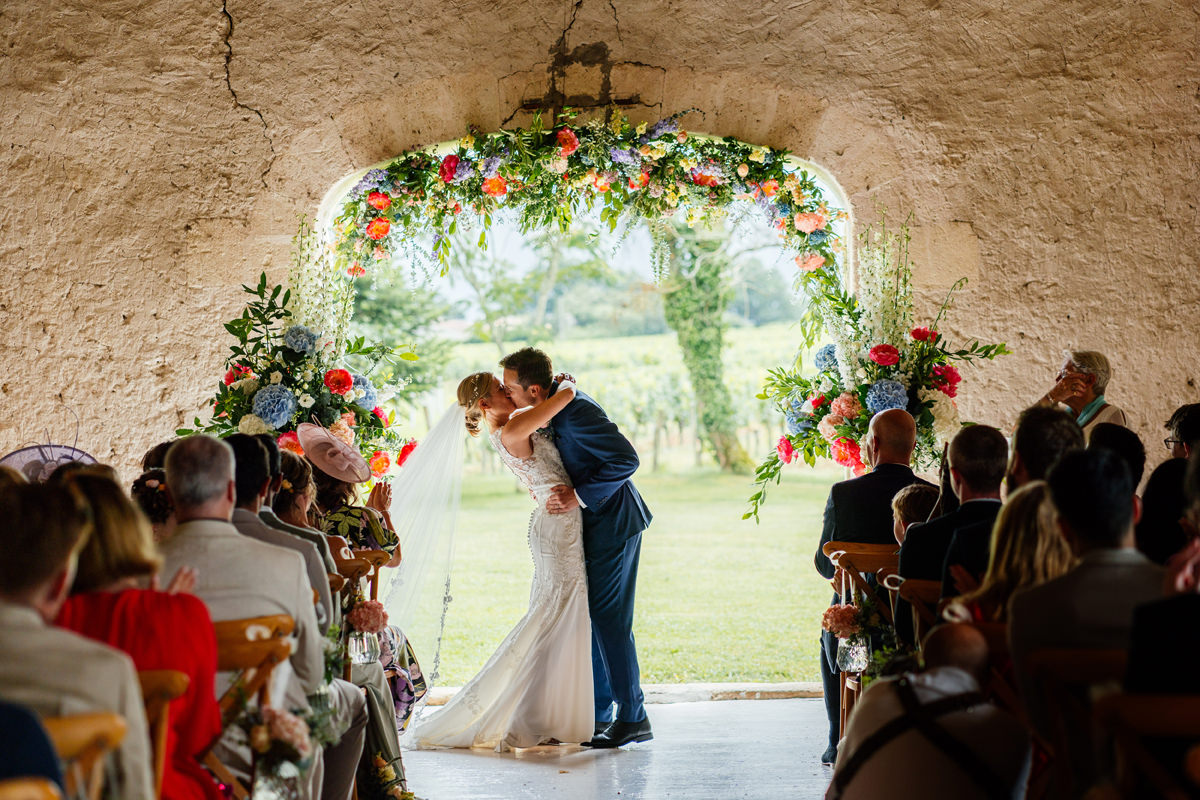 Bride and groom have their first kiss at the end of the ceremony