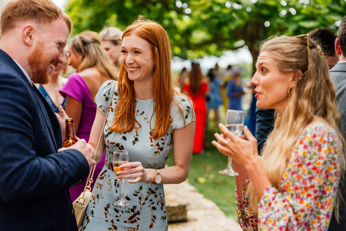 Wedding guests enjoying drinks and canapés during the afternoon