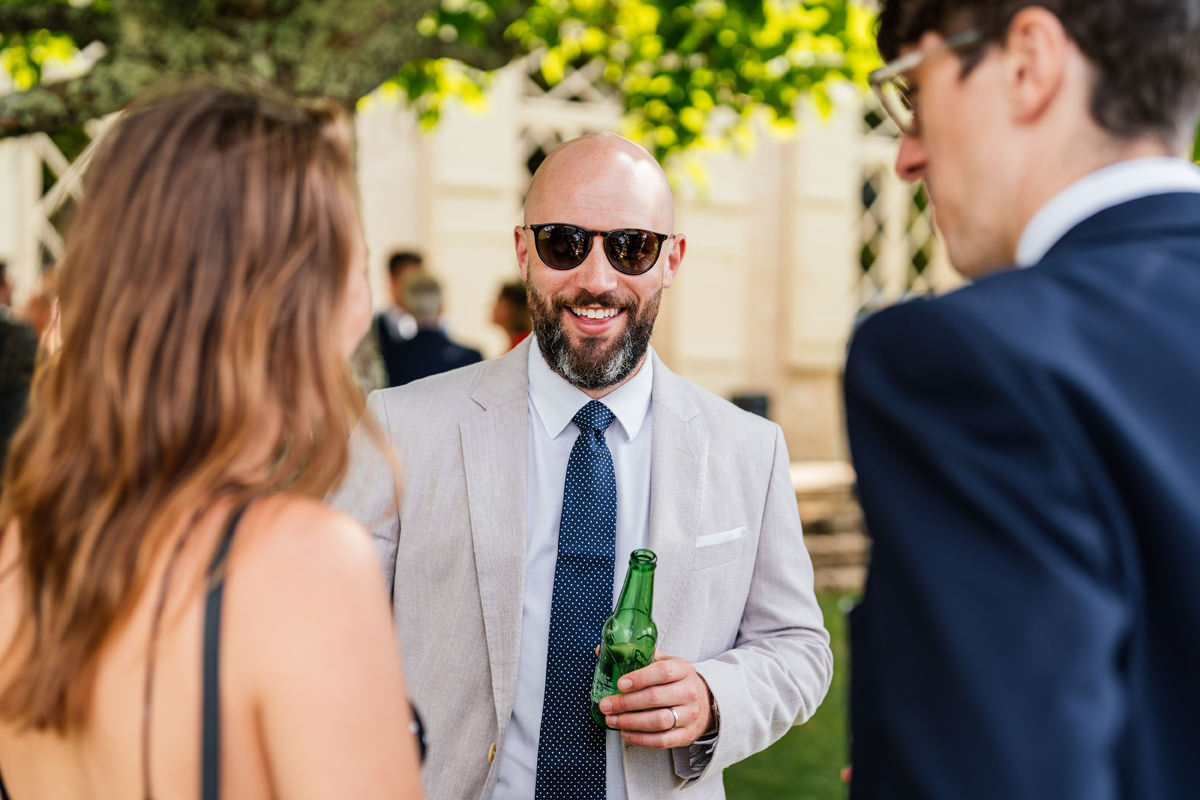 Wedding guest enjoying the drinks reception