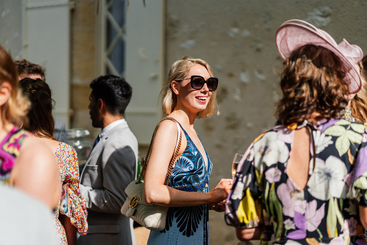 Sun shining on wedding guests during a summer wedding at Chateau Soulac
